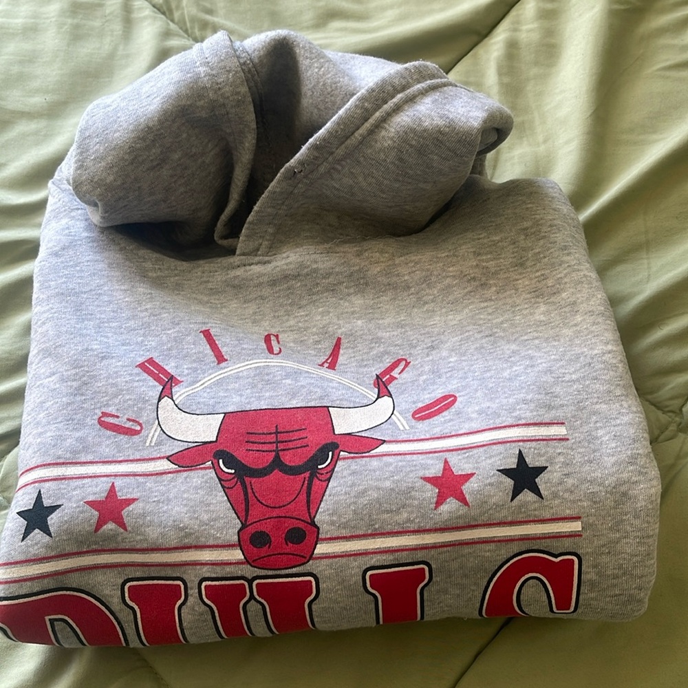 A brand new gray, black, white and red NBA BULLS hoodie.